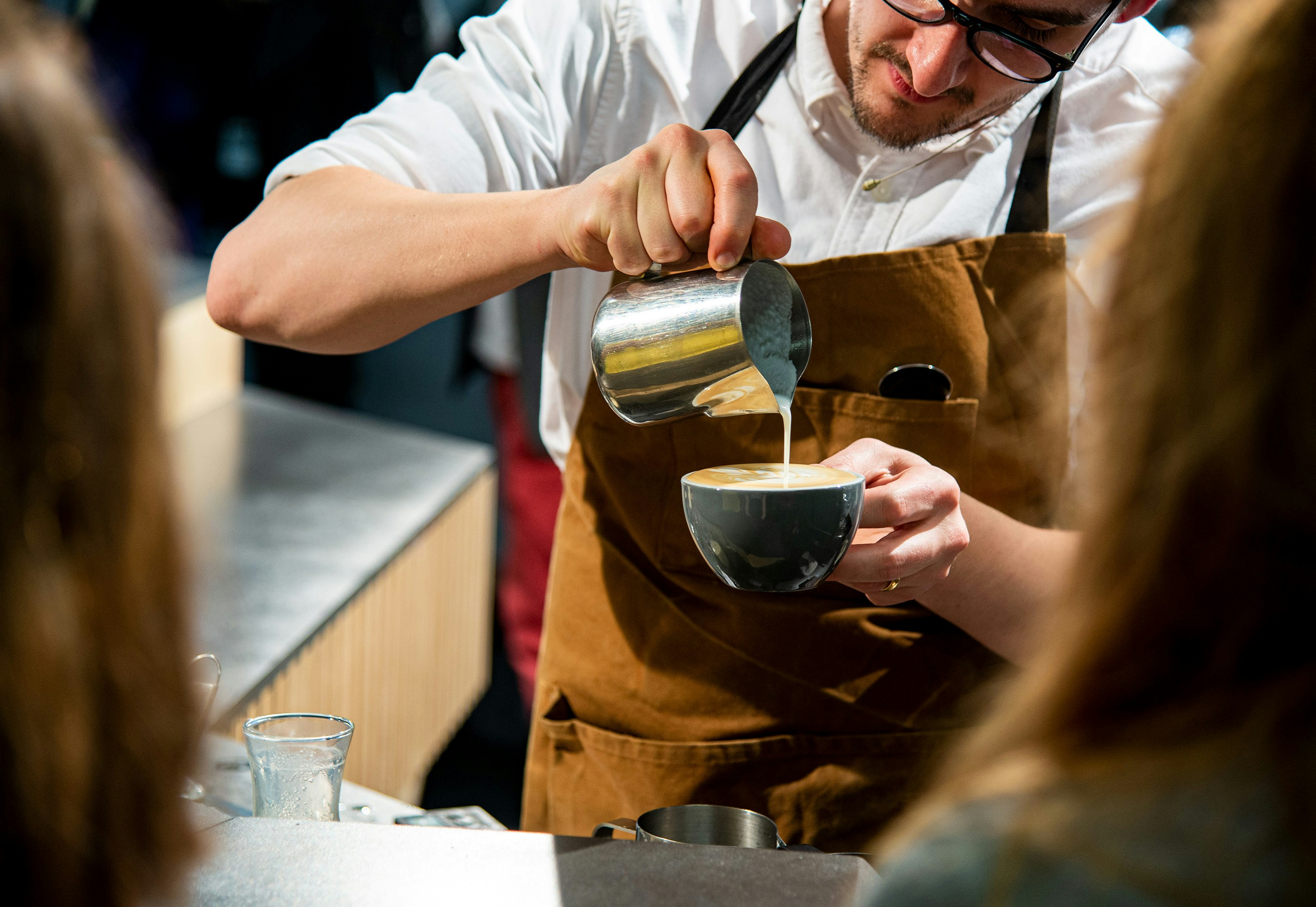 Professional barista training academy in Malaysia with students learning on commercial espresso machines